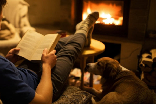 men with book in front of a fire pit. link to evening page